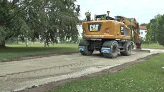 Scania levererar asfalt  2 st Cat grävmaskiner en