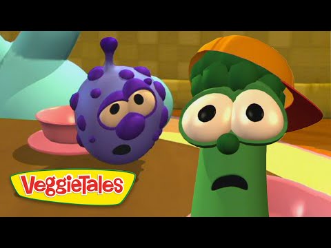 Green vegetable with an orange cap and wide-eyed, surprised expression beside a purple speckled veggie in a colorful VeggieTales set (logo bottom left).