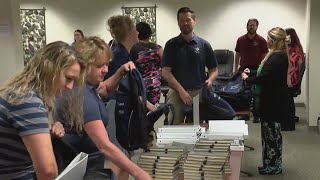 Volunteers donate backpacks, schools supplies