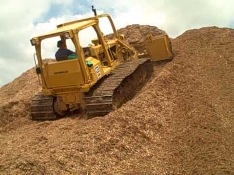 Caterpillar D5 Dozer Moving Mulch up a hill
