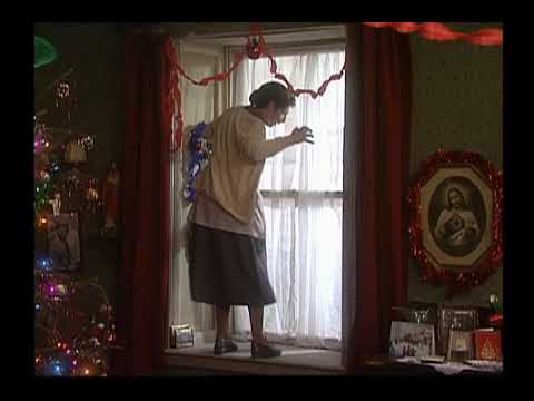 Mrs Doyle decorates a window