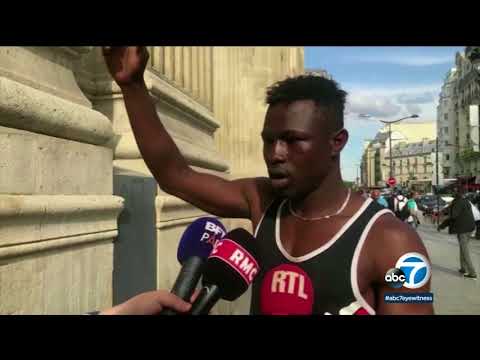 France: Macron rewards migrant hero who saved dangling child I ABC7