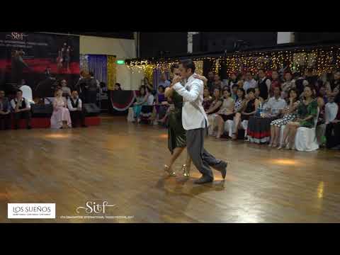  Yanina Quiñones  and  Neri Piliu  are  dancing  to  the  tango  "  Sin Palabras  "  at  Singapore International Tango Festival  in  2017