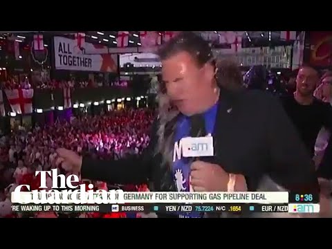 World Cup Fan Tosses Beer Into Reporter's Face During Live Report