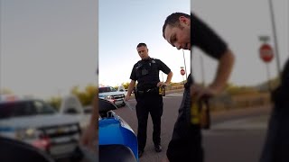 Cop grabs biker out of the road and then finds his fake license plate