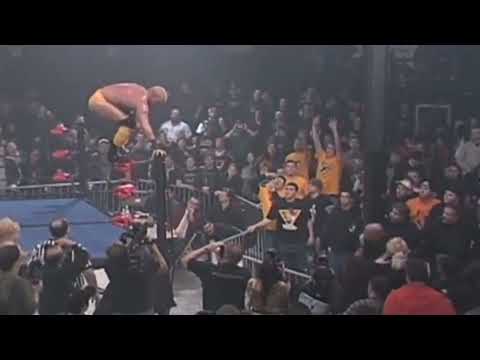Shane Douglas dives over the Guard Rail onto Vic Grimes