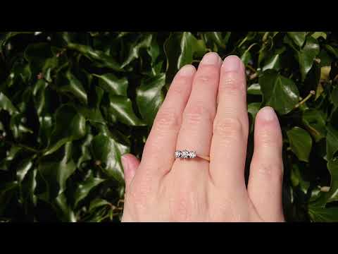 A traditional three stone diamond ring