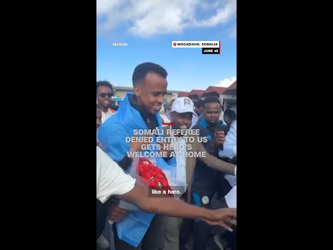 Somali referee denied entry to US gets hero's welcome at home