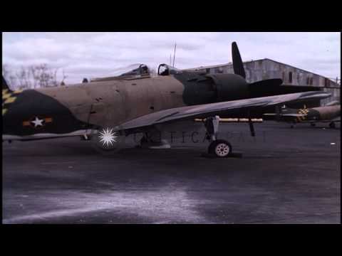 Damaged Vietnamese A1-E and USAF F-100 jet at Bein Hoa Air Force Base, Vietnam. HD Stock Footage