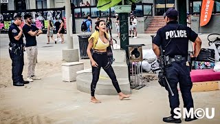 Tension on Venice Boardwalk: Daisy the Venice Healer Confronts Police at a Homeless Encampment