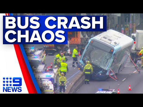 ‘Never seen anything like it’: Bus stuck on concrete barrier after Sydney crash | 9 News Australia