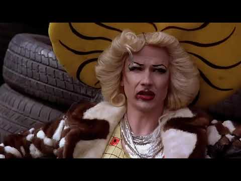 Hedwig and the Angry Inch 2001 trailer frame with Hedwig onstage under hot club lights