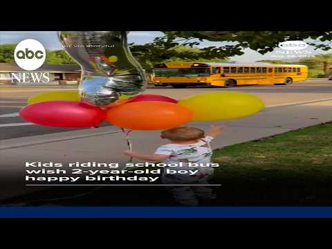 Kids riding school bus wish 2-year-old boy happy birthday