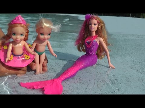 Elsa and Anna toddlers take swimming lessons from Romy the mermaid. Huge Pool