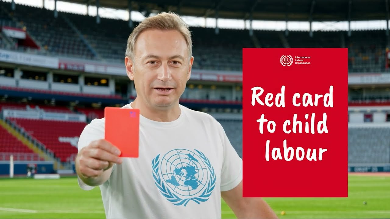 ILO Nepal Director Numan Özcan raises the red card against child labour