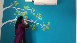 Lovely White Branches - Painting on Blue Wall | Babita Keshan