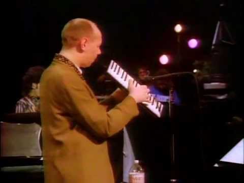 Joe Jackson-(It's a)Big World(The Big World Tour,1986)