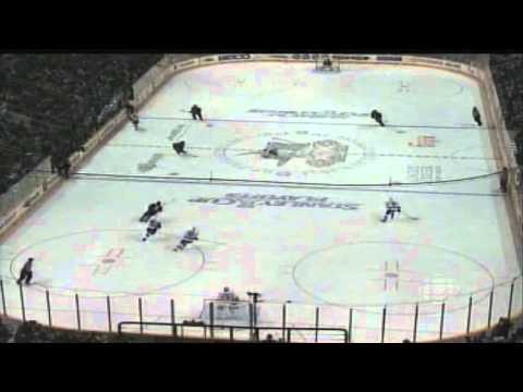 Henrik Sedin heads up play on Logan Couture to draw a penalty