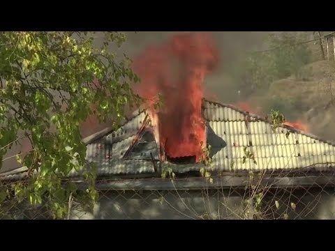 Armenians set homes on fire before Azeri handover