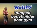 Young bodybuilder post gym flex and posing all pumped up
