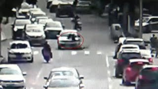 Residents Lift Car to Save Old Woman