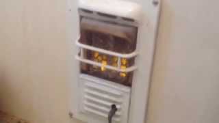 Old bathroom natural gas wall heater working