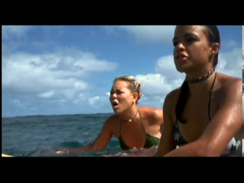 Blue Crush (2002) official trailer thumbnail with surfers paddling into a Hawaiian set