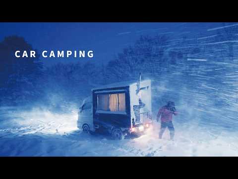 Danger! Blizzard! Car camping in the frozen snowy mountains! A light truck camper with a wood stove