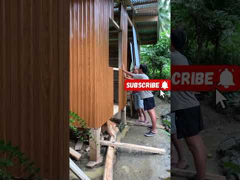 WOOD HOUSE, AND WALL METAL CLADDING INSTALLATION.