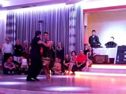  Adrian Veredice  and  Alejandra Hobert  are  dancing  to  the  tango  "  Recuerdo  "  by  Osvaldo Pugliese  at  Canary Islands Tango Festival  in  2014