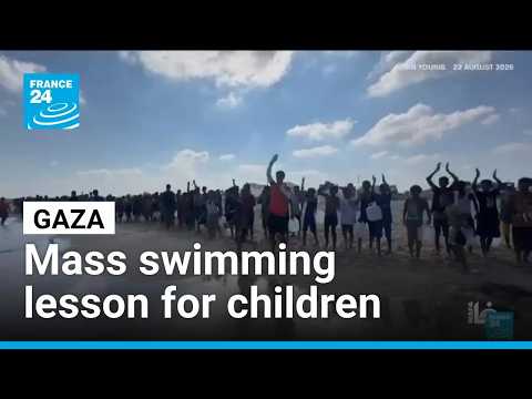 Hundreds of Gaza children join a mass swimming lesson to cope with trauma