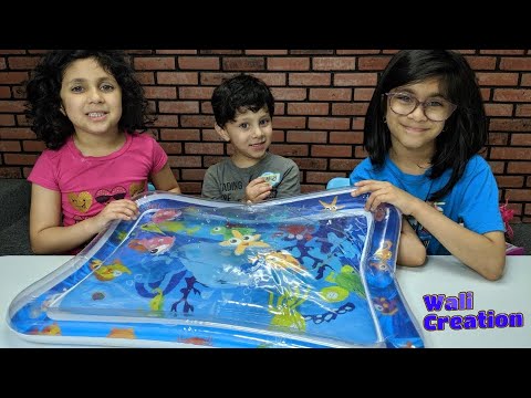 Wali and Sisters play with  Water Play Mat and Colorful Sea Creatures Video