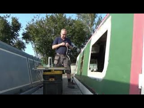 Narrowboat build and fit out installing a window