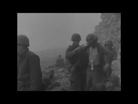 Dramatic combat footage showing US troops landing on OMAHA BEACH early on D-Day 6 June 1944