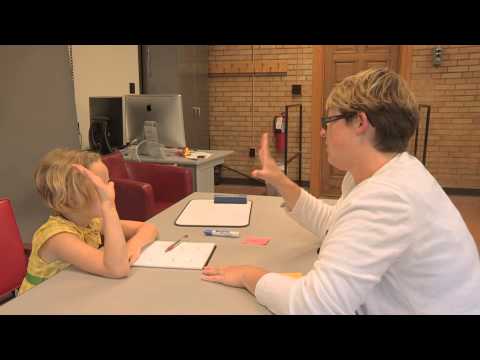 Emily Tonti teaches phonics lessons with a severely dyslexic child