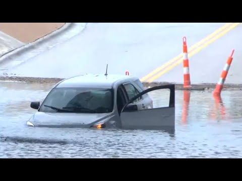 Flooding debris lines curbs in Indiana as rain keeps falling