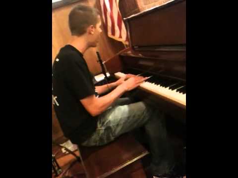 Cody hogland singing and playing piano to someone like you.