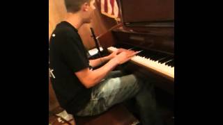 Cody hogland singing and playing piano to someone like you.