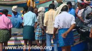 Fishing boat returning with the catch to Vizhinjam beach