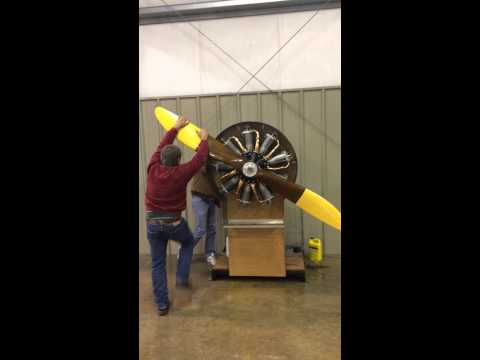 Hand propping a Le Rhône rotary engine