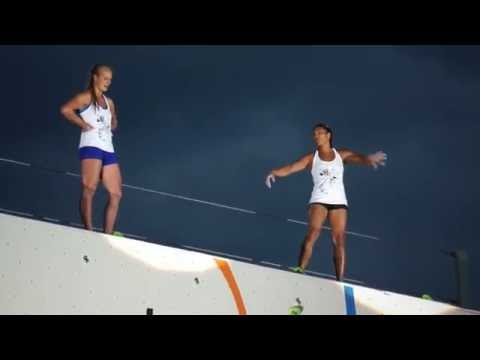 Meagan Martin and Natalie Bärtschi jump off of the top of the 55-foot  Psicocomp 2016 wall