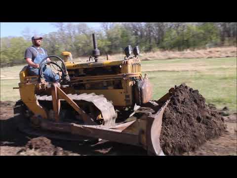 fixing the road with a D2 Caterpillar and pull grader.
