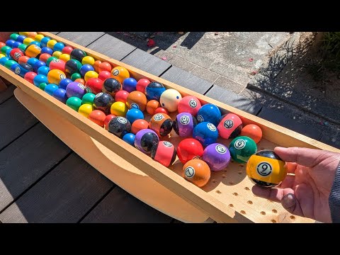 Marble run race. Wooden seesaw handmade course