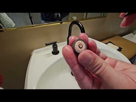 Part of a video titled Glacier Bay Bathroom Faucet How to Remove Flow Restrictor - YouTube