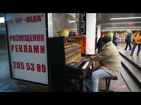 Ukraine, Kyiv metro underground under maidan Square man playing robert miles children: