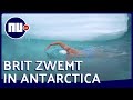 Brit zwemt zonder duikpak onder smeltende ijskap door | NU.nl
