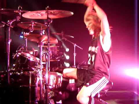 ZOLTAN CHANEY DRUMMER KICKING CRASH CYMBAL