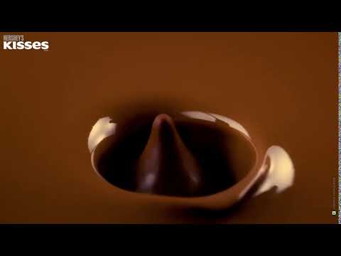 Dropping delicious Hershey's KISSES Milk Chocolate
