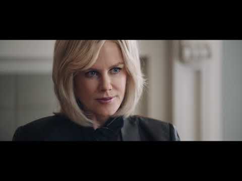 Bombshell trailer frame of bustling newsroom with producers on headsets