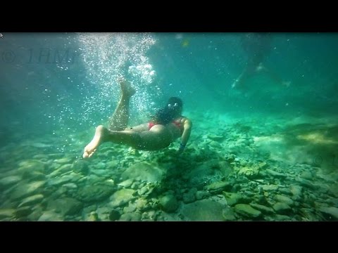Pretty Girls Underwater swimming-  slow motion - Xcaret, Caribbean Sea - Maya Riviera